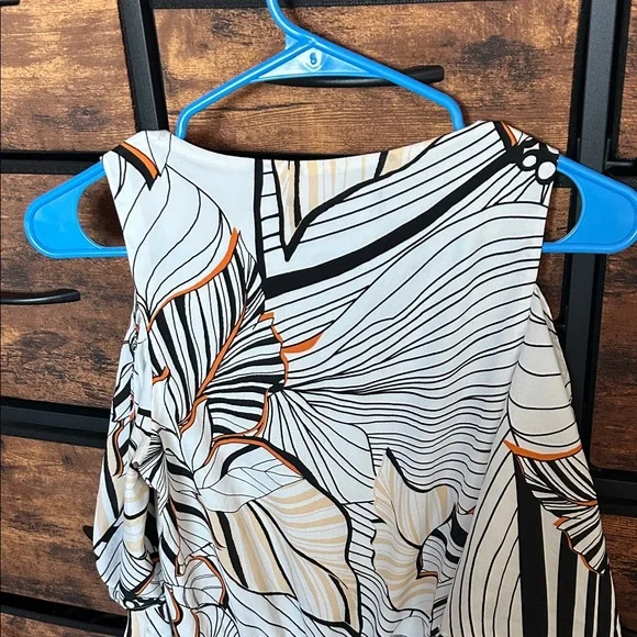 Adelyn Rae Black and Orange Patterned Romper - Picture 8 of 9